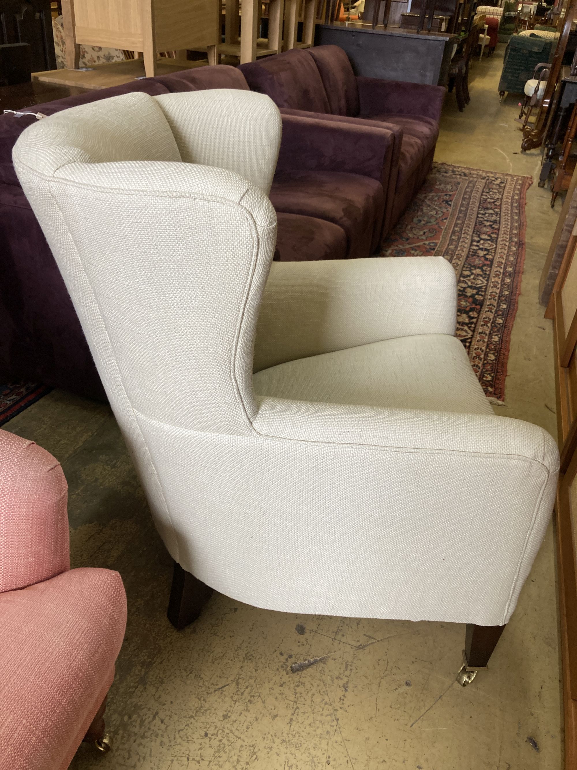 A contemporary upholstered armchair, width 68cm, depth 80cm, height 96cm